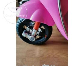 .Pink Vespa 6V Electric Ride On Scooter & Charger.